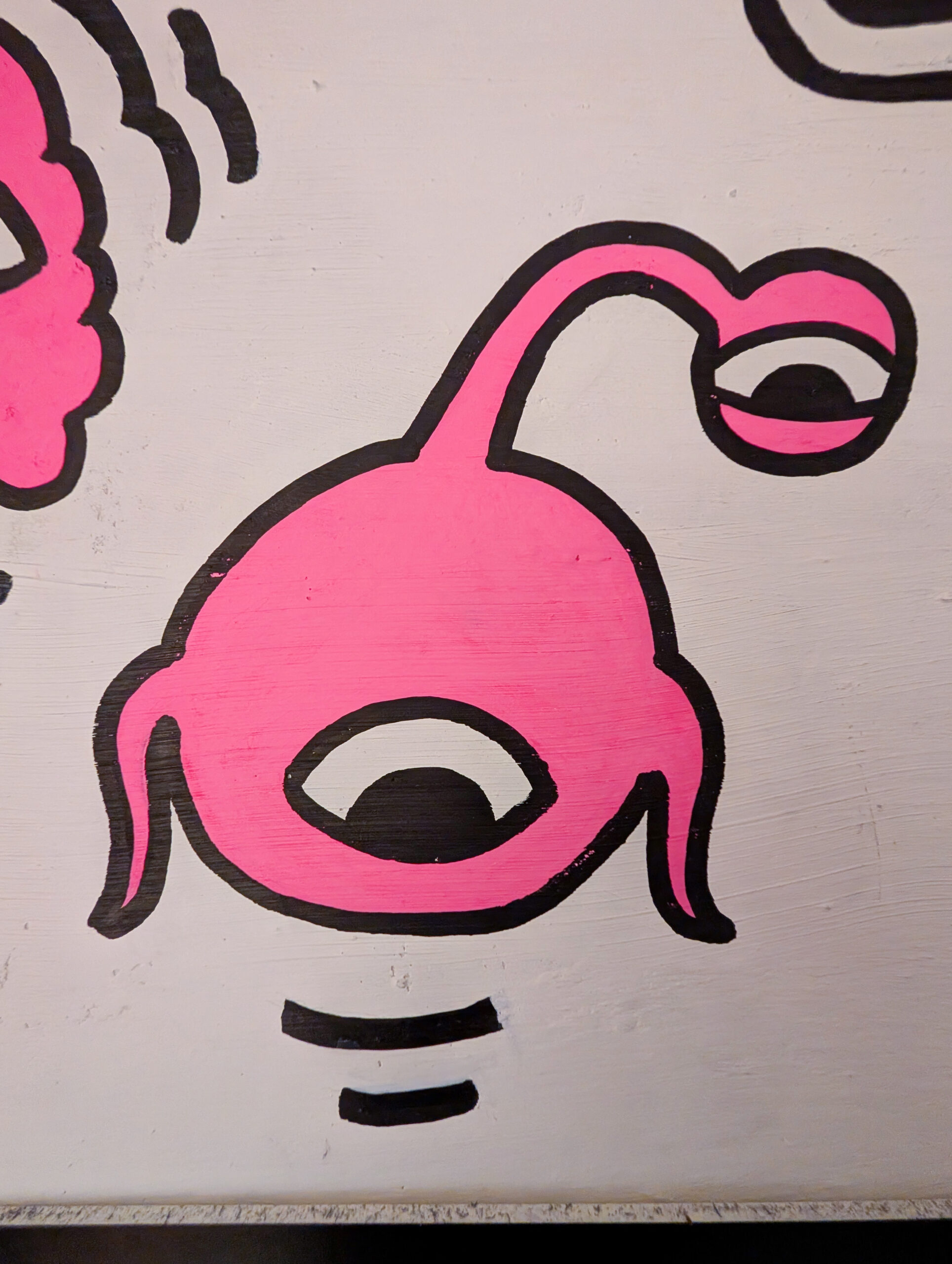 Gros plan sur une créature de la fresque du B21